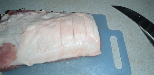 slices in the boneless pork loin to mark the location of the cuts for steaks