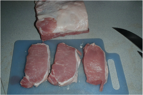 Boneless porkloin cut into centre cut steaks and centre cut roast
