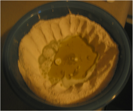 bowl with wet and dry ingredients for the pie dough