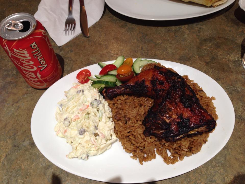 Jerk Chicken Dinner with coleslaw, salad and rice and beans Picture