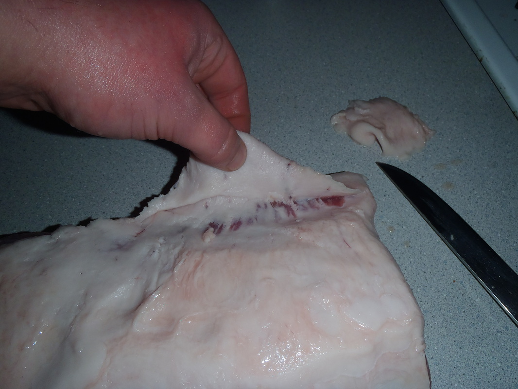 Jay Eatz triming the excess fat from the boneless pork loin