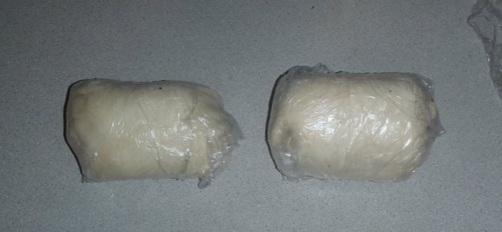 pastry wrapped beef wellington in plastic wrap