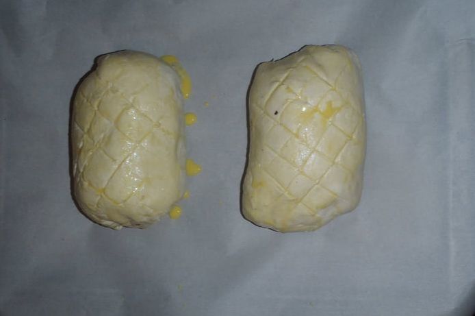 beef wellington with egg wash and scorring before going into the oven