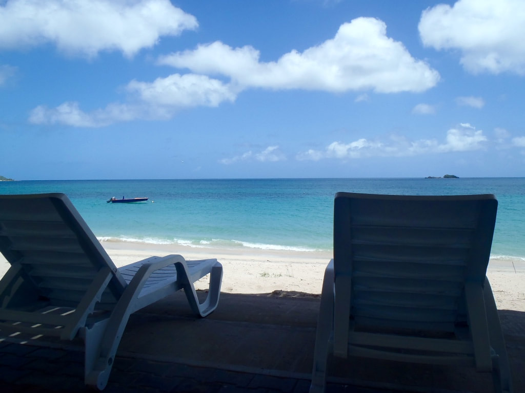Beach loungers on the lover patio at the Mermaid Hotel in Carriacou