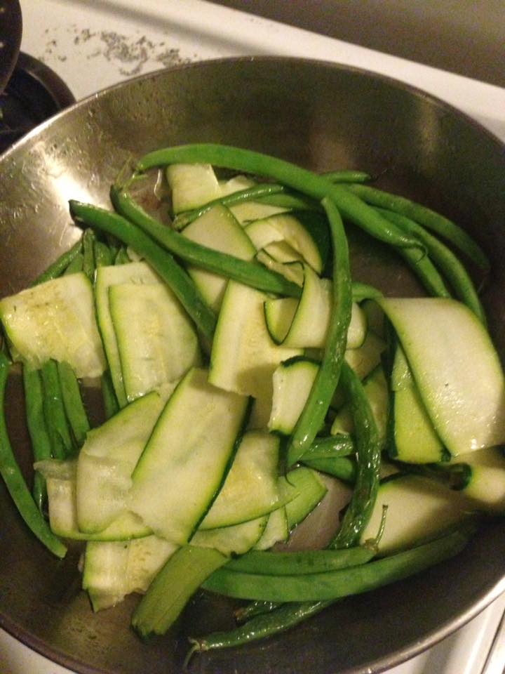 zucchini and green beans in frying pan